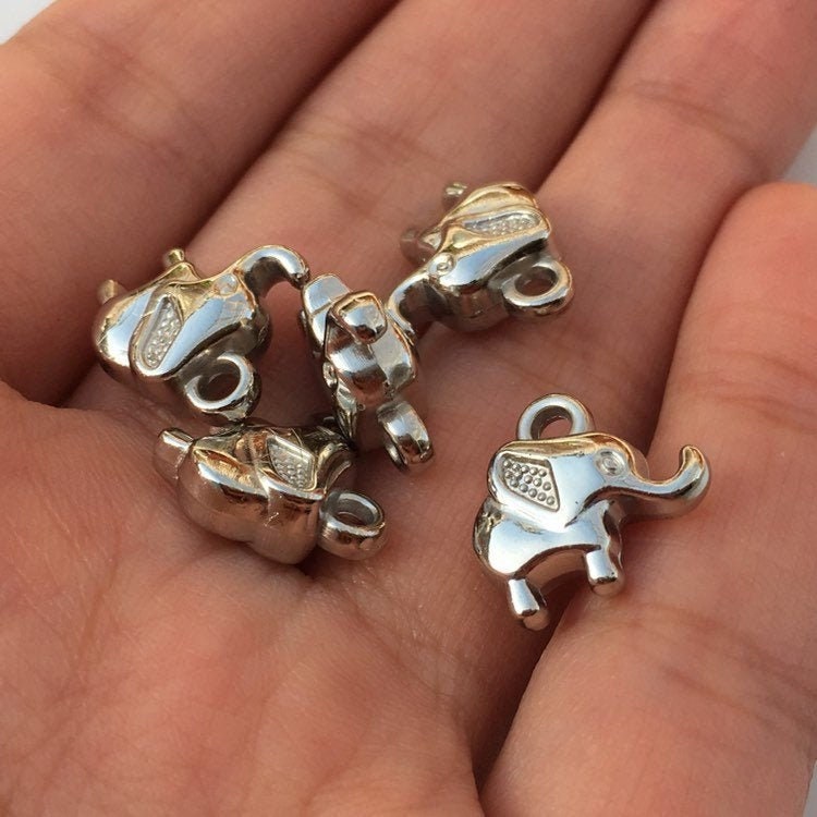 hand holding baby elephant charms